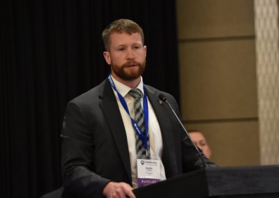 Kevin Conine, Special Agent in the FBI Cyber Task Force, speaks at the 2024 Cybersecurity Symposium.