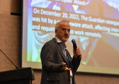 Chant Vartanian, Dr. Erdal Ozkaya, Chief Information Security Officer at Xcitium, speaks at the 2024 Tech Valley Cybersecurity Symposium.